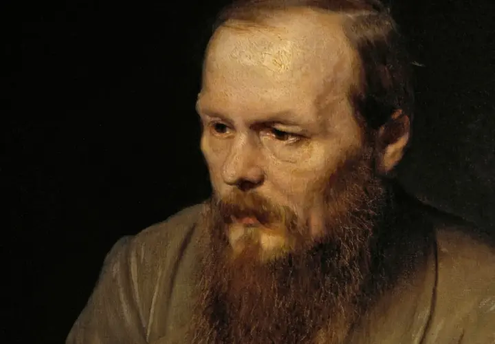 Portret mężczyzny z burą brodą, którego spojrzenie zdaje się odzwierciedlać objawy szaleństwa u protagonistów w powieściach psychologicznych Dostojevskiego.